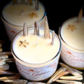 Three candles labeled 'Ocean Goddess' with starfish decorations on a dark background.