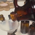 Pouring Arnica Oil from brown bottle