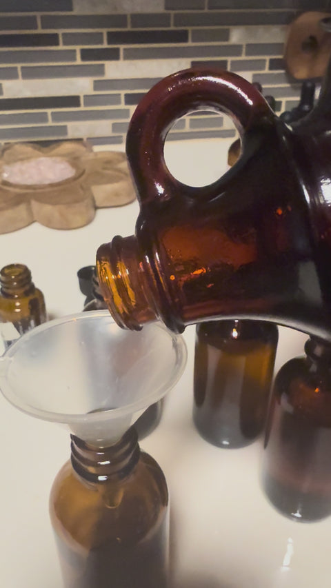 Pouring Arnica Oil from brown bottle
